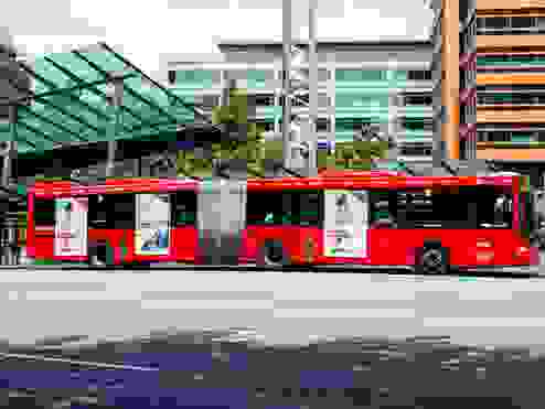 A red long bus